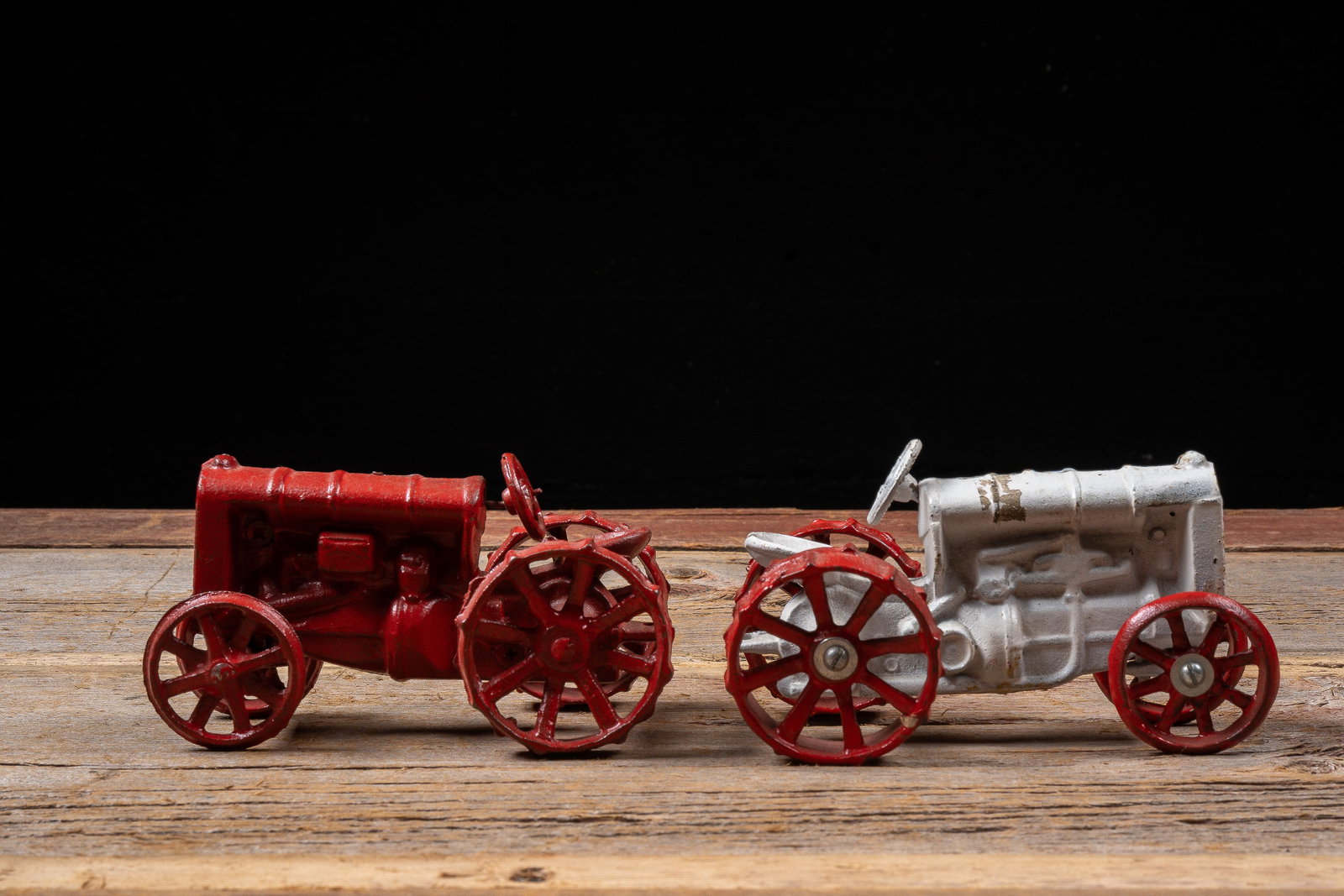 Pair of Cast Iron Toy Tractors: **NOTE: Any shipping quotes provided on this screen or on your Live Auctioneers invoice are provided by Live Auctioneers. In-house shipping is available on all lots. For in-house shipping quotes,