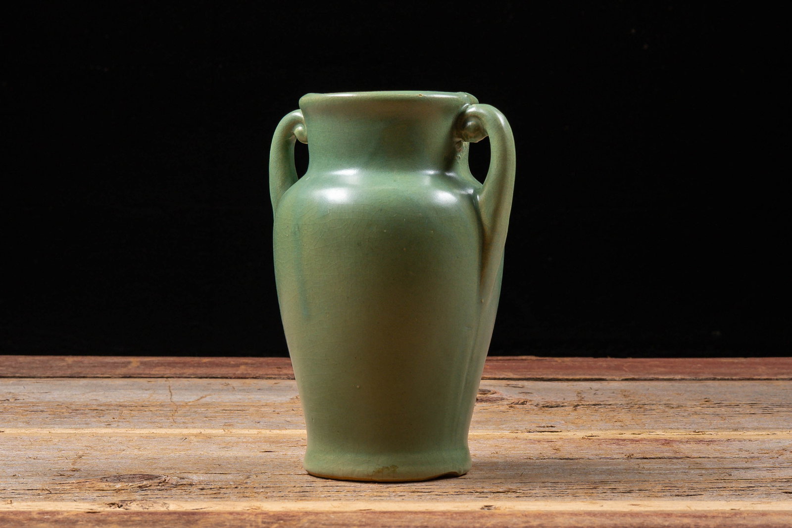 Green Glazed Double Handle Pottery Vase: **NOTE: Any shipping quotes provided on this screen or on your Live Auctioneers invoice are provided by Live Auctioneers. In-house shipping is available on all lots. For in-house shipping quotes, plea