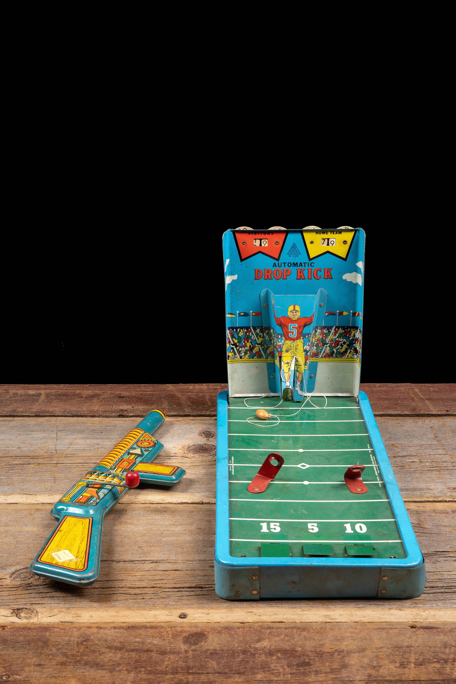 Gotham Drop Kick Game with T Cohn Toy Gun: **NOTE: Any shipping quotes provided on this screen or on your Live Auctioneers invoice are provided by Live Auctioneers. In-house shipping is available on all lots. For in-house shipping quotes,