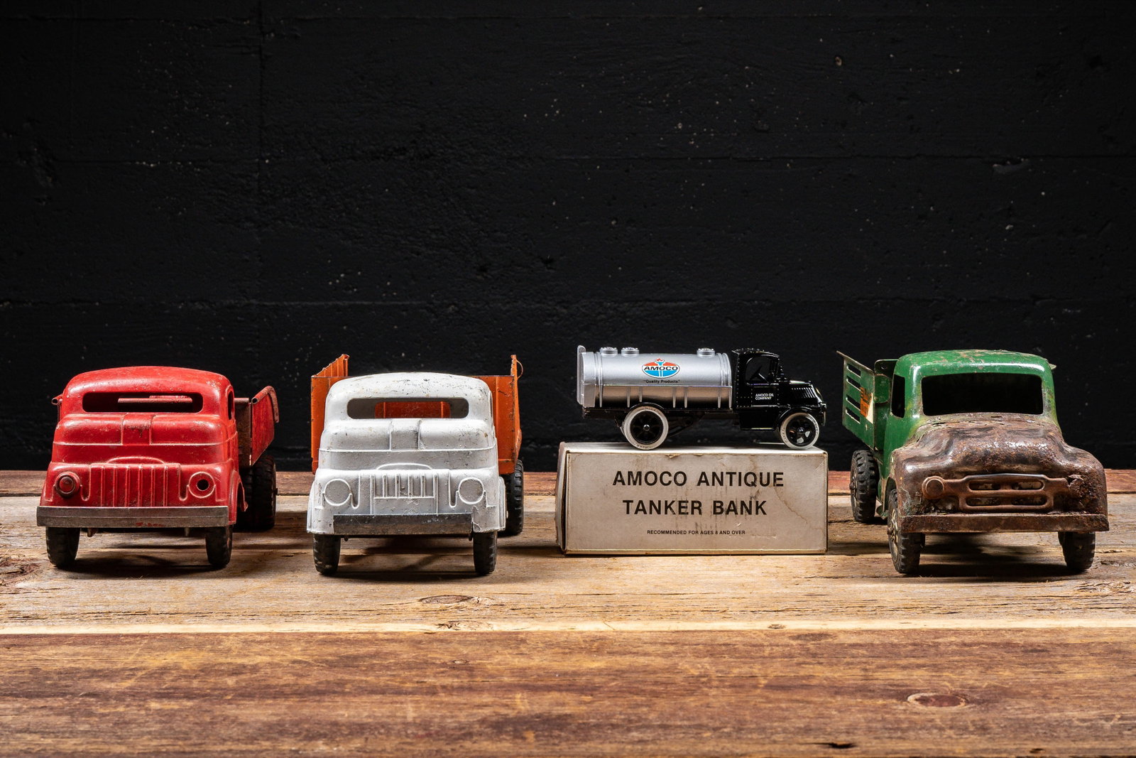 Pressed Steel Toy Truck Lot with Amoco Bank: **NOTE: Any shipping quotes provided on this screen or on your Live Auctioneers invoice are provided by Live Auctioneers. In-house shipping is available on all lots. For in-house shipping quotes,