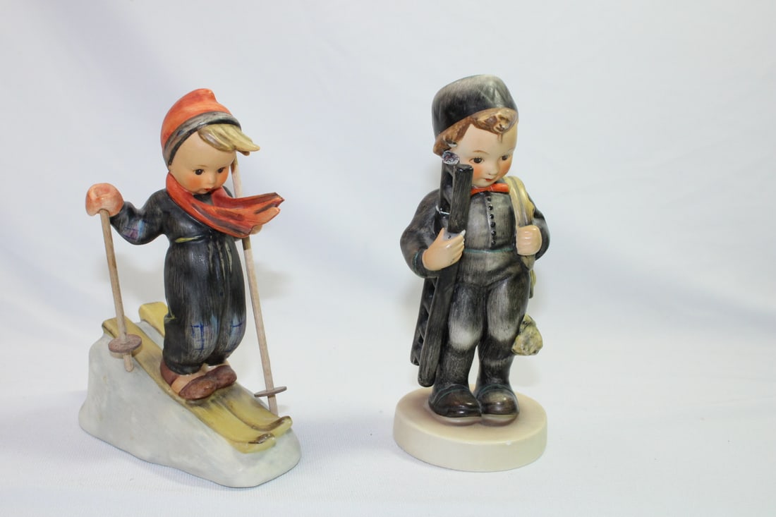 Lot of Two Hummel Figurines: note: they are not in excellent condition - Skier: chip at the top of his scarf, and missing end of one of the ski poles - marked - 5 1/4" tall - Chimeny Sweep: head and ladder is restored as shown on