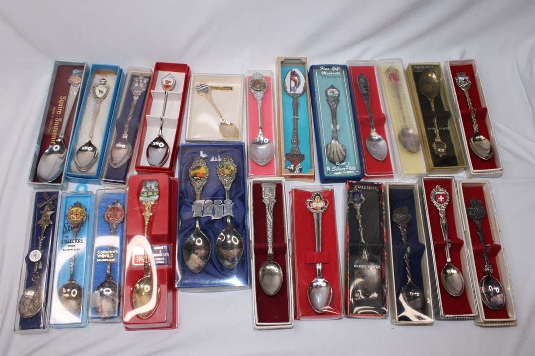 Lot of 24 Collectible Spoons: souvenir spoons - mostly silverplated - in decorative boxes - from all over the world - countries from Switzerland to Fiji - average 4 1/2" long, some are longer, some are shorter