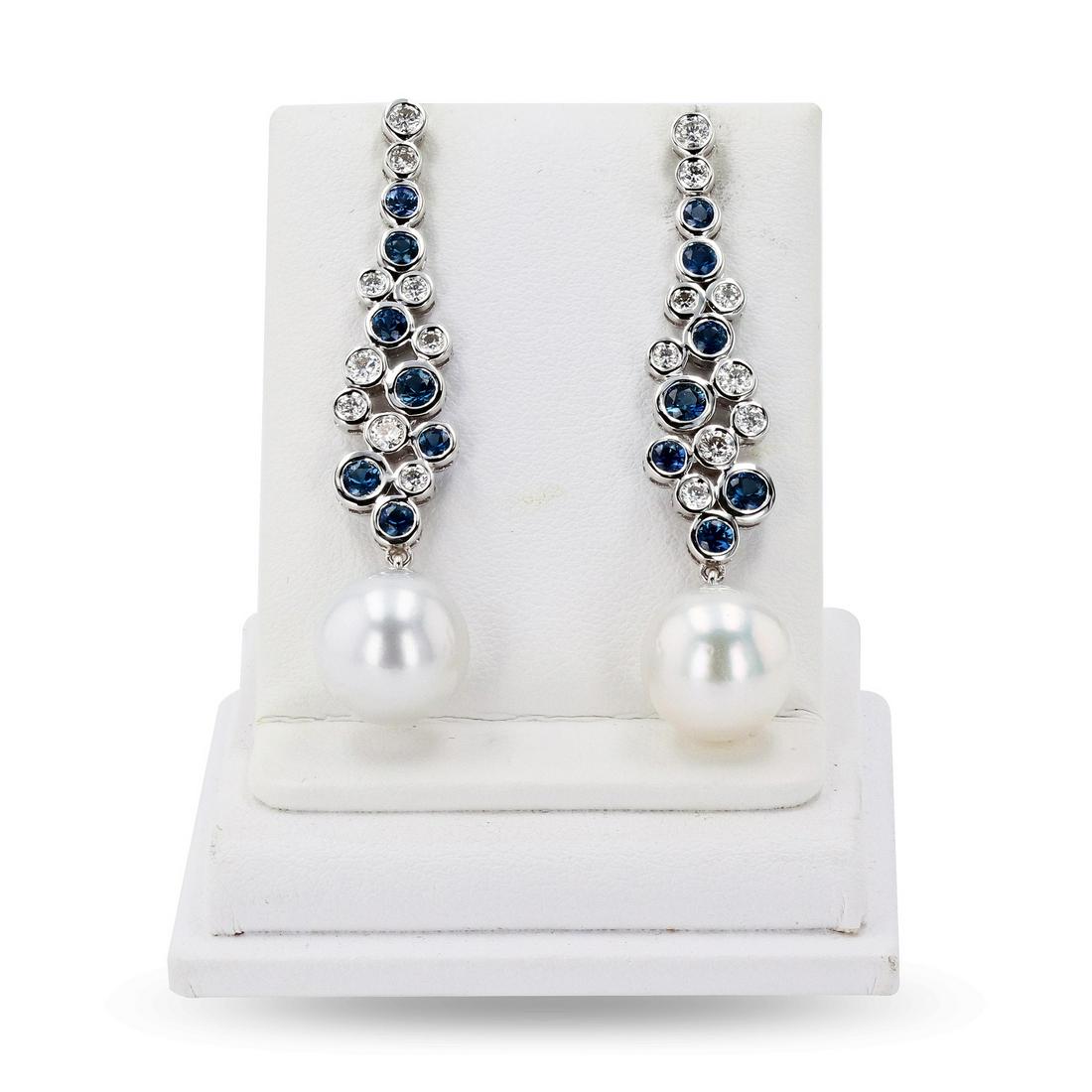 11mm South Sea Pearl and 1.70ctw Blue Sapphire and 0.86ctw Diamond 18K White Gold Earrings: 11mm South Sea Pearl and 1.70ctw Blue Sapphire and 0.86ctw Diamond 18K White Gold Earrings **** One polished, stamped, and tested pair of 18K white gold earrings with friction posts and backings. The