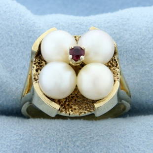 Designer Akoya Pearl and Ruby Target Ring in 14K Yellow Gold: In 14K Yellow Gold. Contains four 7mm Cultured Akoya Pearls with creamy white color and pink undertones, beautiful nacre and luster. Also contains one high quality natural .09ct round cut Ruby gemston