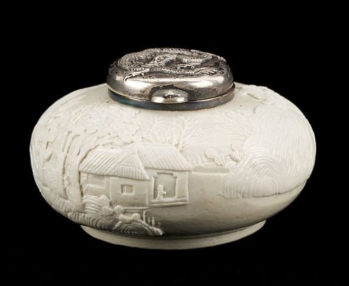Chinese Silver and Dehua Porcelain Water Coupe: Finely carved and molded Chinese white glazed porcelain water coupe or pot, featuring a scene of a house in a landscape setting encompassing the circumference of the vessel, with hinged