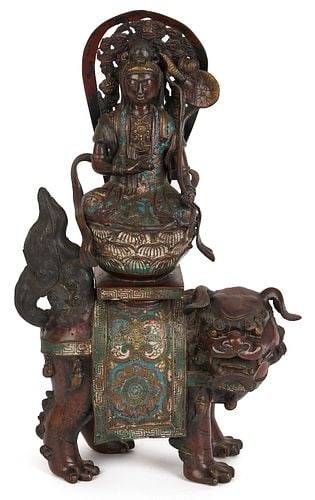 Chinese Bronze & Champleve Statue, Guanyin w/ Foo Dog & Carved Stand: Chinese bronze and champleve sculpture depicting Guanyin, the Bodhisattva of compassion, atop a lotus blossom on the back of a Foo Dog or Guardian Lion. All on a later carved wooden stand. B
