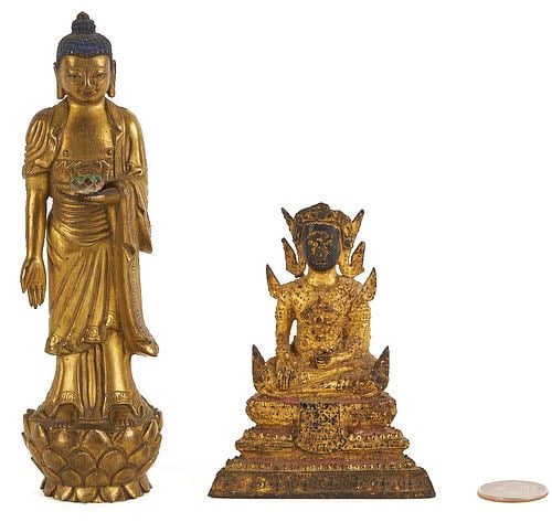 Two Small Gilt Buddha Figures: Two small gilt bronze Buddha figures, Chinese or Southeast Asian, one of heavy gilt and patinated bronze, standing atop a lotus pedestal, 6 1/2 in. H., and the other of gilt metal, seated atop a