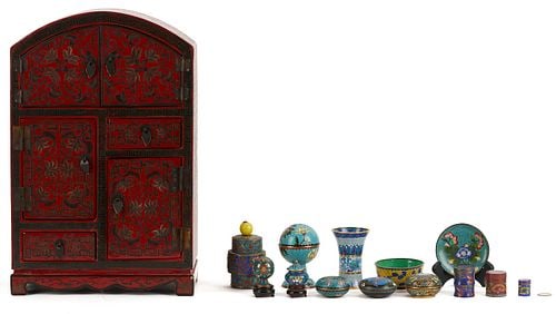 Miniature Chinese Cloisonne Items w/ Lacquer Cabinet: Chinese red lacquer miniature curio cabinet with foliate decoration, having three cupboard compartments and two drawers, arched top and scalloped bracket base, together with a collection of 13 miniatu