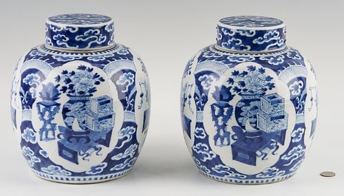 Pair of Chinese Blue & White Ginger Jars: Pair of Chinese blue and white covered ginger jars with "hundred antiques" decoration. The bases are marked with two concentric circles. 10 in. H x approx. 8 1/4 in. W. Late 19th/Early 20th