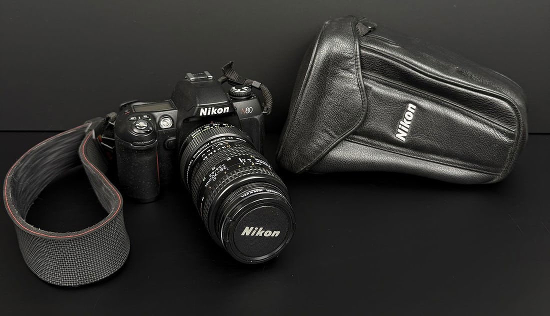 Nikon N80 SLR Film Camera: Comes with Nikon AF Nikkor 28-70mm 3.5-4.5 Lens. Working condition.