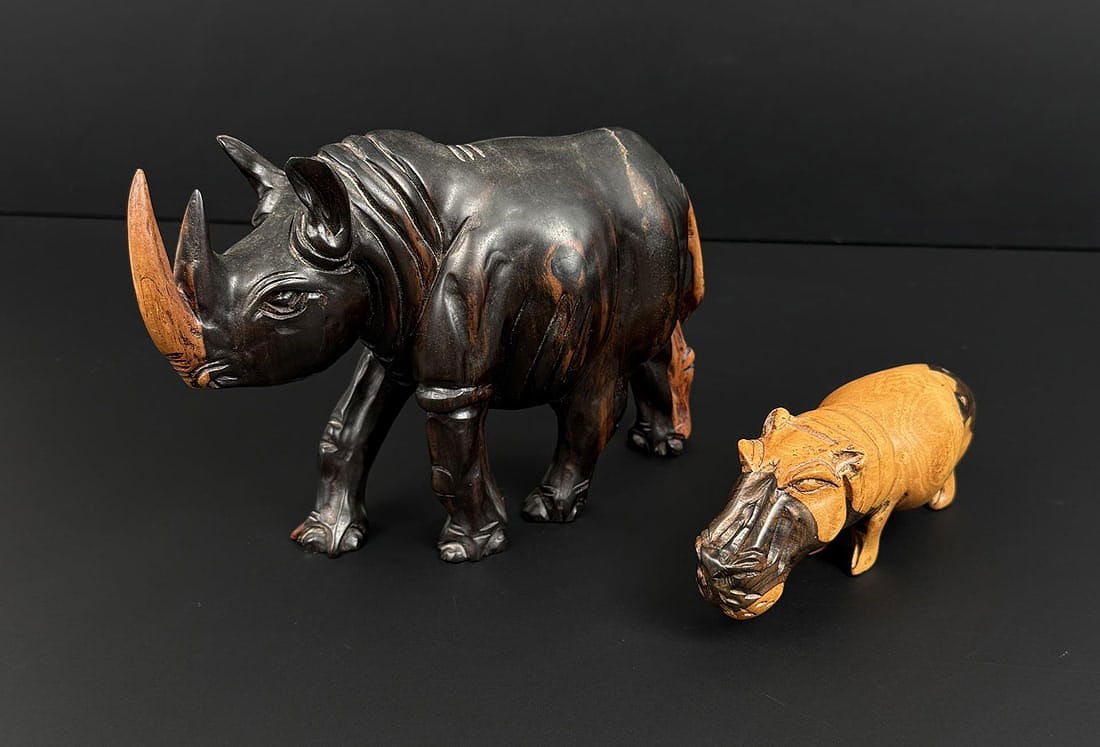 African Carved Wood Rhinoceros and Hippopotamus: The rhino is 7 7/8" by 5 1/2" by 3 1/4".