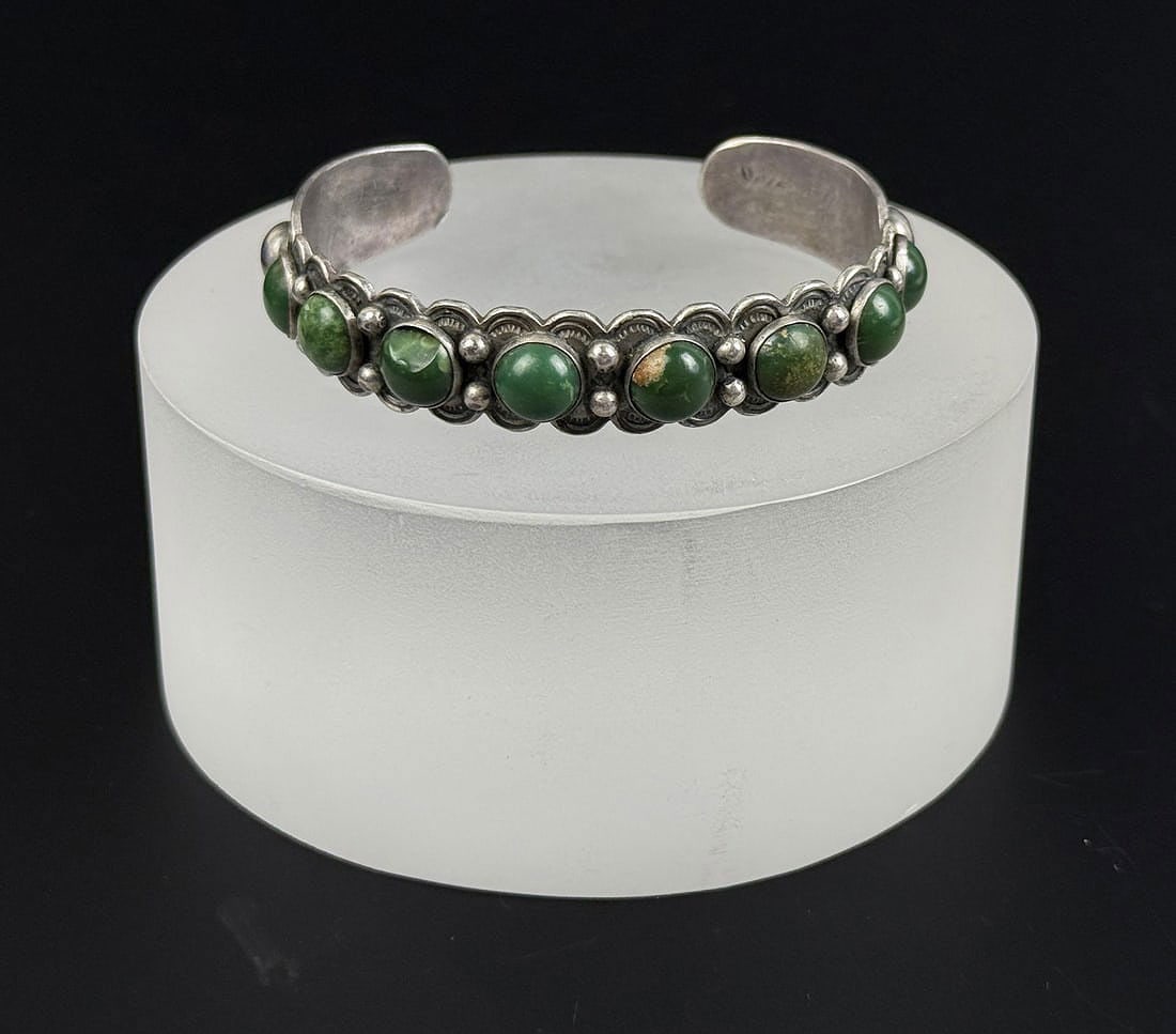 Fred Harvey Era Navajo Sterling Turquoise Bracelet: 6" inner circumference. One stone chipped. 23.37 grams.