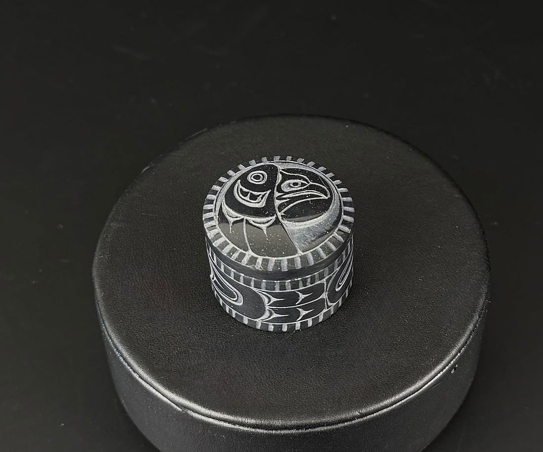 Denny Dixon Haida Miniature Argillite Box: 1 1/8" diameter, 3/4". Denny Dixon Born 1944 Skidegate oh Haida Gwaii, British Columbia. Known for: Argillite poles, boxes, pendants and broaches. Denny is a member of the Eagle clan. He works primari