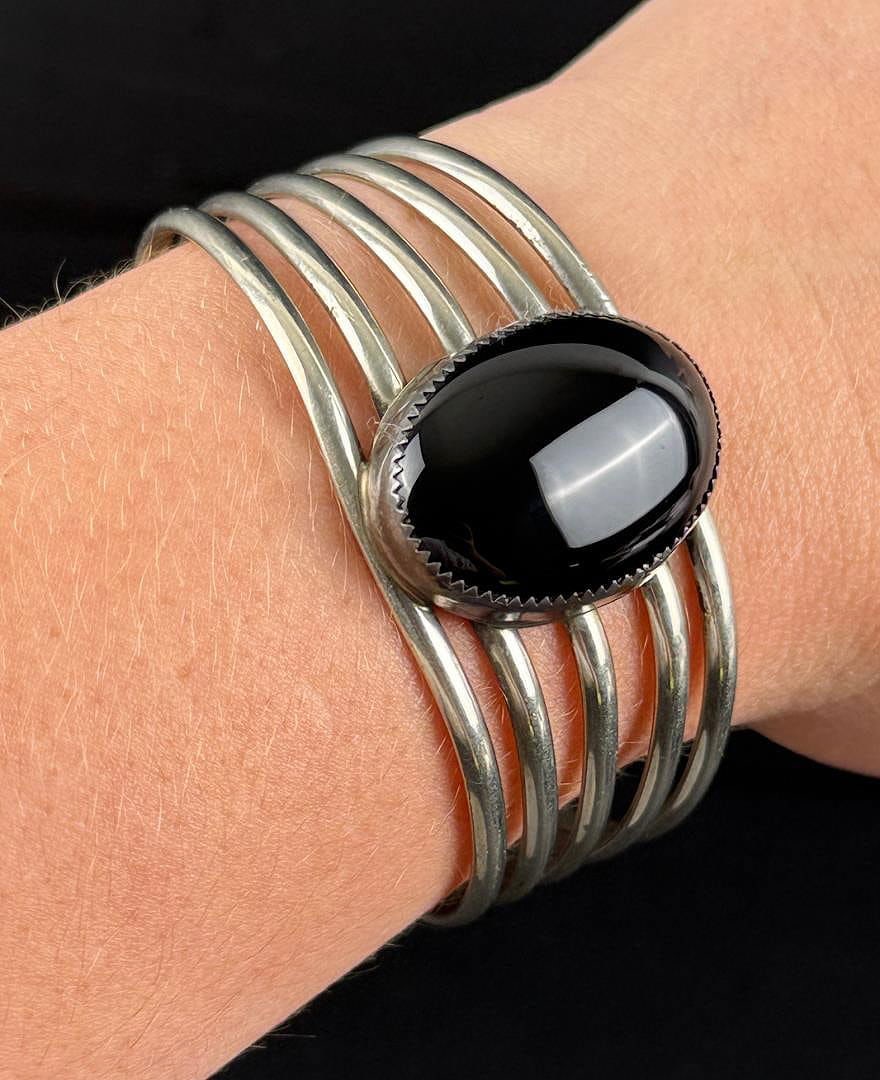 Sterling Silver Onyx Bracelet: 29.78 grams. 6 1/4" inner circumference.