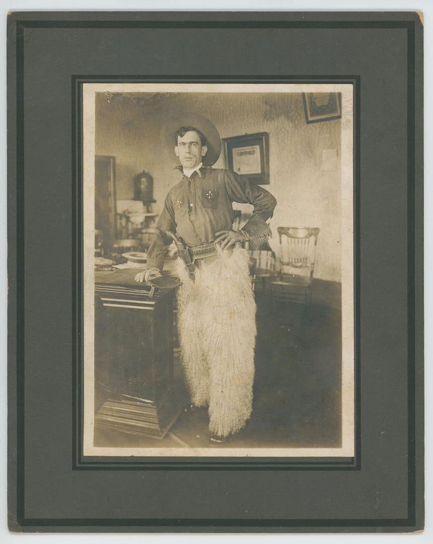 Cowboy Gunfighter in Wooly Chaps Photo: 8" by 10". Unidentified subject.