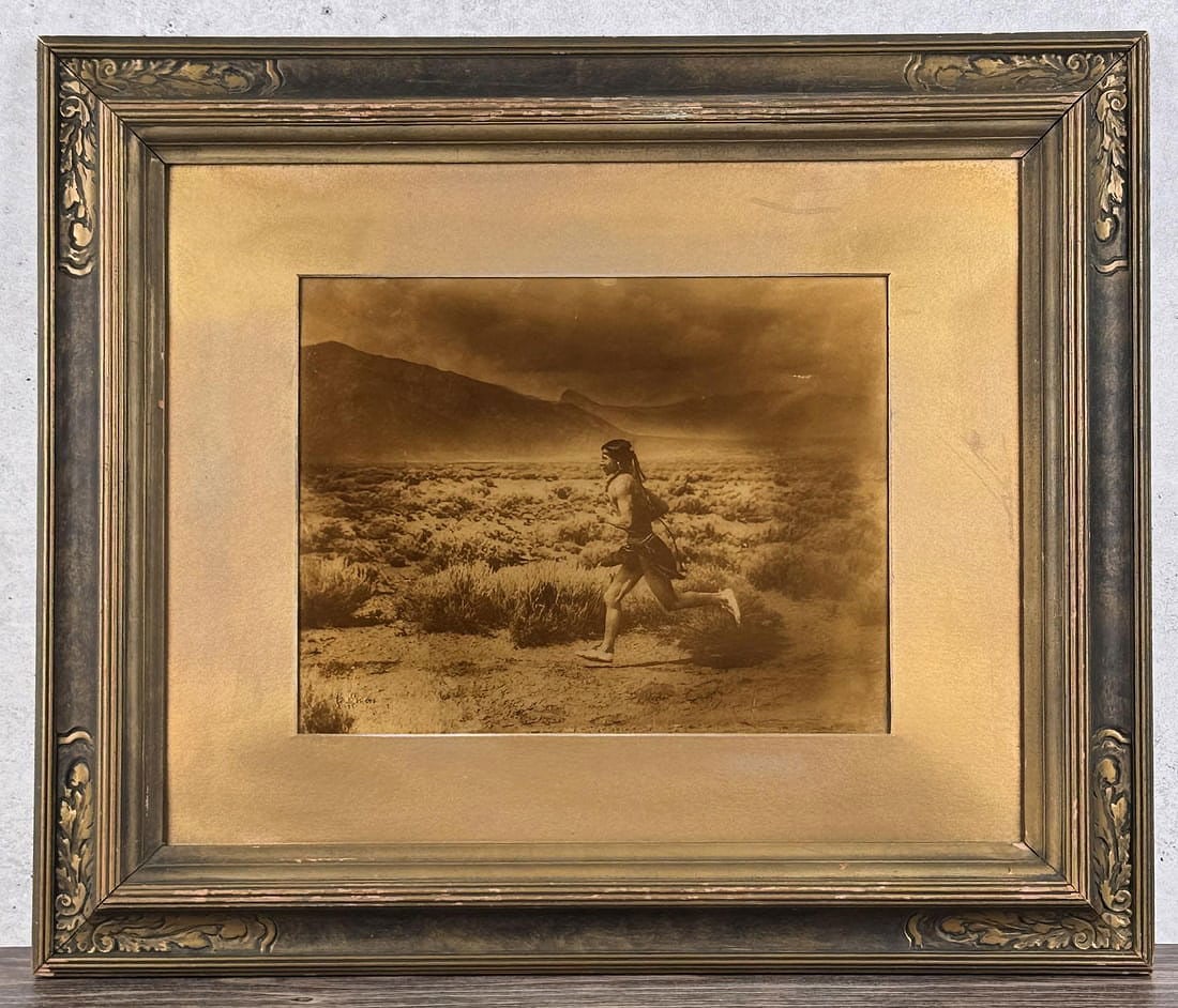 Carl Moon The Runner Orotone Indian Photo: Title is The Runner. In original frame with original back paper and label. 21 1/2" by 25 1/2" framed. Carl (Karl) Everton Moon (1879 - 1948) was active/lived in California, Arizona, Ohio. Carl Moon is