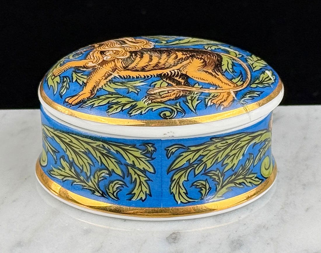 William De Morgan Porcelain Trinket Box: Featuring a detailed lion, this trinket box is from William De Morgan Museums and Galleries. 1" by 1 5/8" by 2"