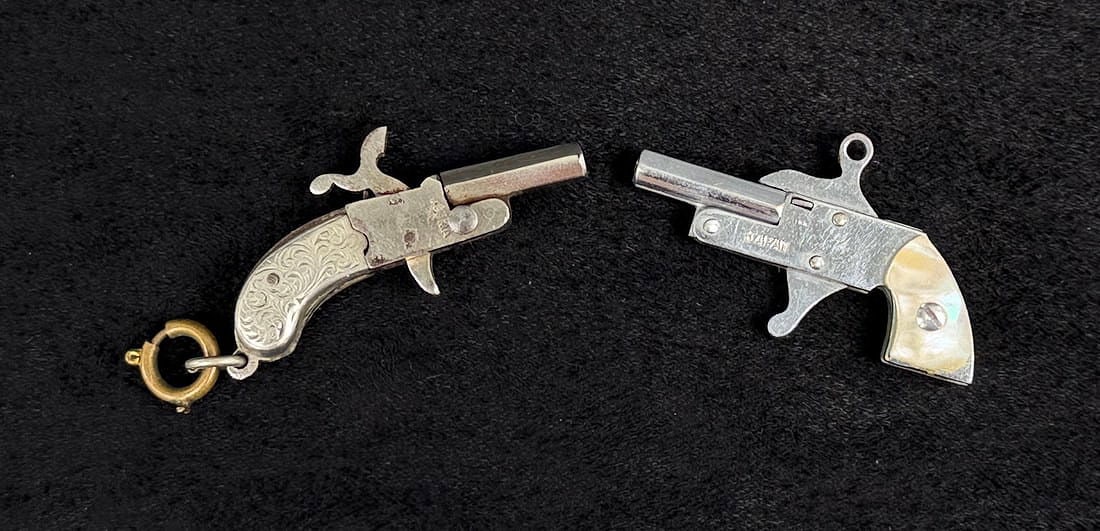 Pair of Miniature Cap Toy Pistols: 1 3/4" largest length.