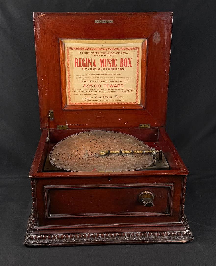 Regina Coin Operated Disc Music Box: Quite Scarce. Working Condition. 22" by 20" by 11 1/2".