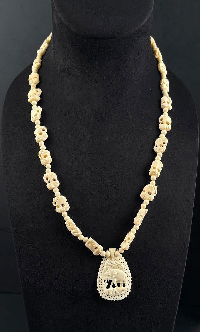 Carved Bone Elephant Necklace: 15" long as displayed