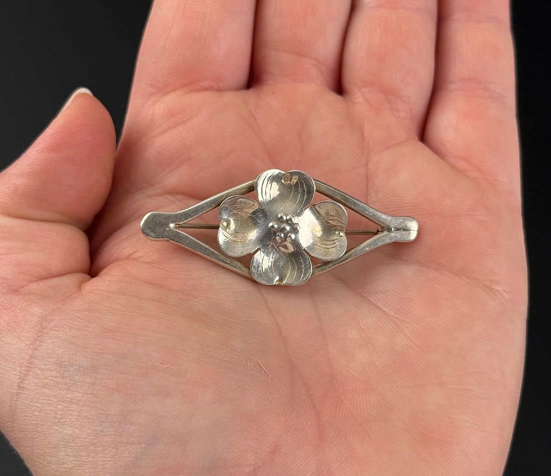 Stuart Nye Sterling Silver Dogwood Flower Brooch: Marked Handmade. 5.52 grams. 1 6/8" by 3/4" by 1/4".