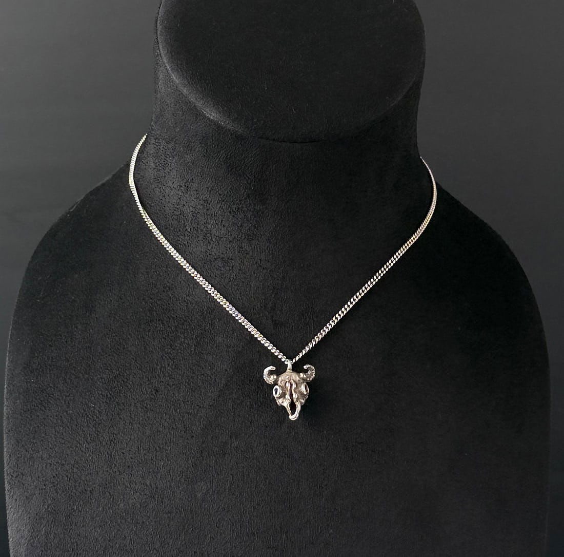 Sterling Silver Buffalo Skull Necklace: 8.84 grams. 9" long as displayed.