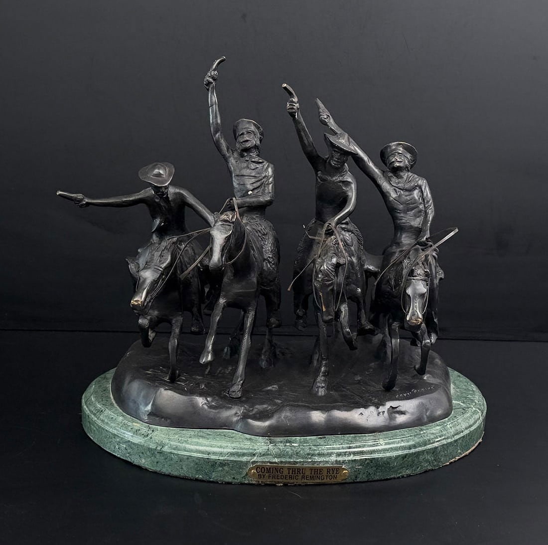 Frederic Remington Coming Through the Rye Bronze: Title is Coming Through the Rye. 14 3/4" by 12 3/4" by 10 3/4". Frederic Sackrider Remington (1861 - 1909) was active/lived in New York, Kansas, Connecticut. Frederic Remington is known for Western pa