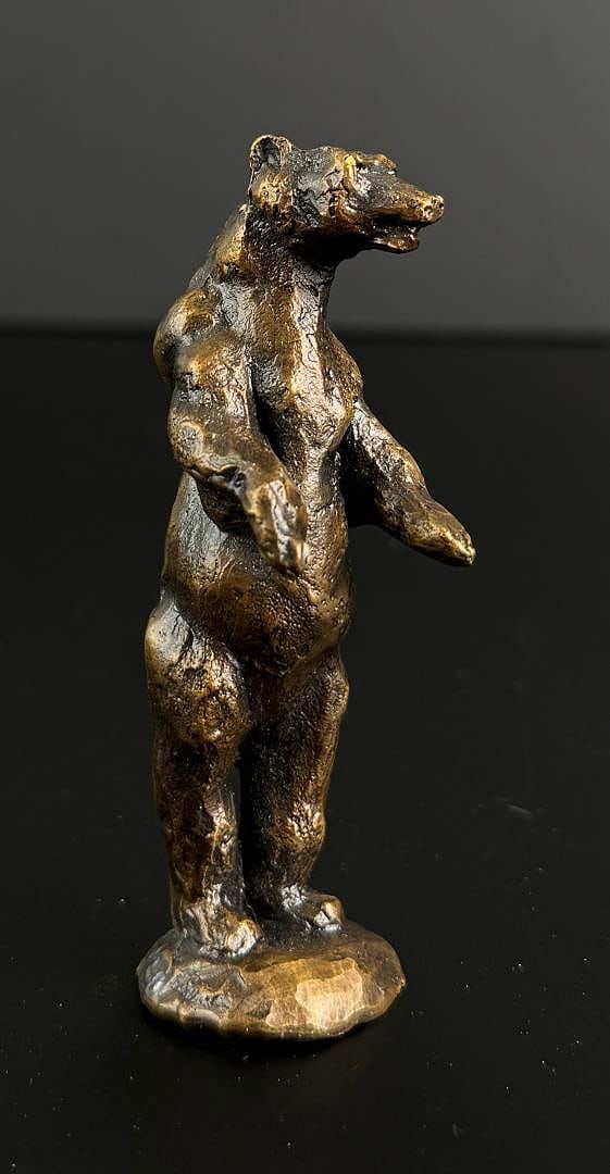 Daro Flood Alert Bear Bronze: Title is Alert Bear. 1 3/8" by 1 3/8" by 5 3/8". Number 15/20. Daro Flood (1954 - 2017) was active/lived in Arizona. Daro Flood is known for Portrait bust Indian and cowboy sculpture. Daro Flood was a
