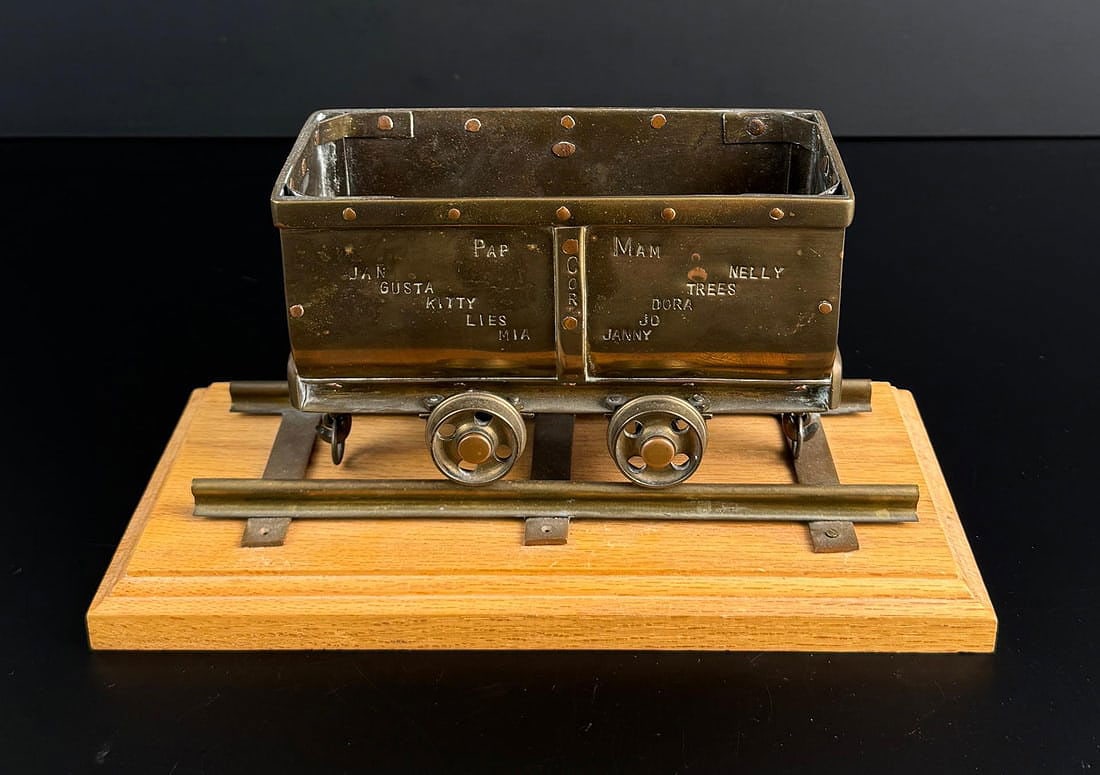 Salesman Sample Presentation Miners Ore Cart: Outstanding miniature ore cart. Made from brass, with copper rivets. Appears to feature the miners family tree on the side as shown. 10" by 5" by 5" as displayed.