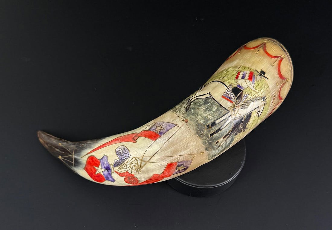 Mexican Carved Steer Horn Drinking Cup: Painted with a bull fighter. Measures 9 1/2" long.