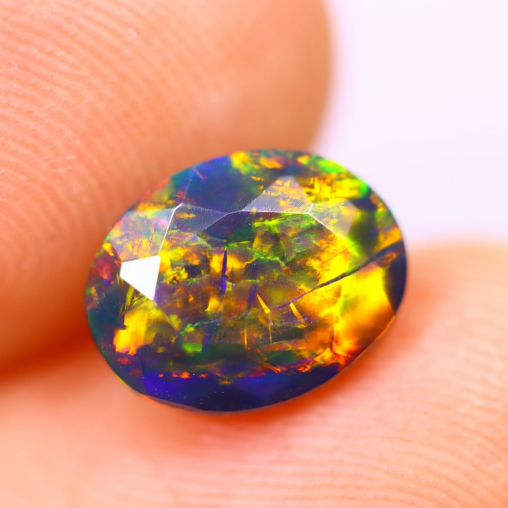 1.17Ct Welo Black Opal Polished - Ethiopian Opal - Oval Faceted: Ksmith Jewels Global Welcome to our auction house, today auction brought to you by Ksmith Jewels Global based in Penang, Malaysia specialize in all kinds of opal and color gemstone both in manufacturi