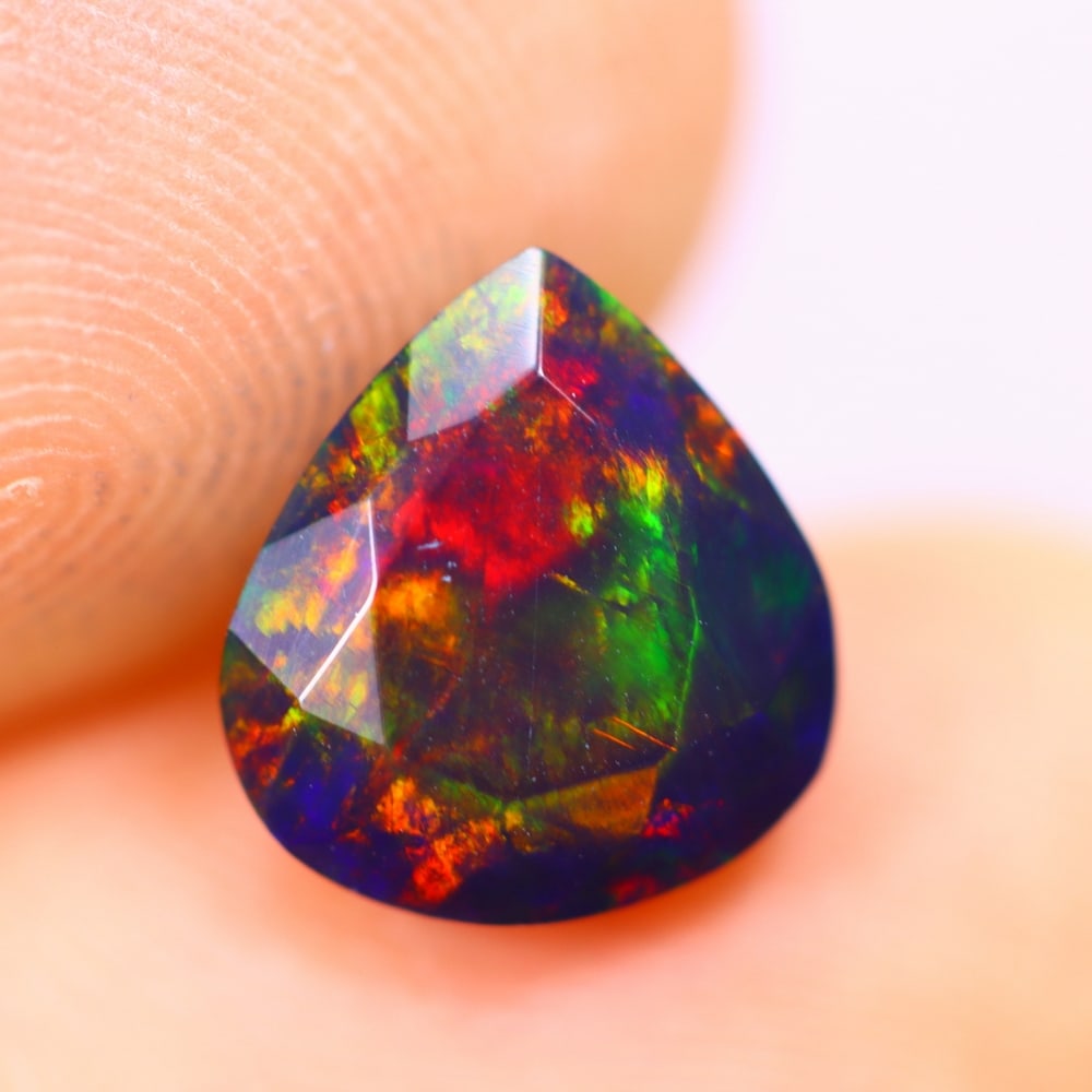 1.57Ct Welo Black Opal Polished - Ethiopian Opal - Pear Faceted: Ksmith Jewels Global Welcome to our auction house, today auction brought to you by Ksmith Jewels Global based in Penang, Malaysia specialize in all kinds of opal and color gemstone both in manufacturi
