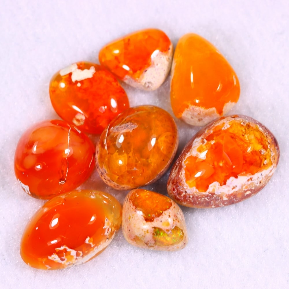 28Ct Group of 8 Mexican Fire Opal - Mexican Opal - Cabochon: Ksmith Jewels Global Welcome to our auction house, today auction brought to you by Ksmith Jewels Global based in Penang, Malaysia specialize in all kinds of opal and color gemstone both in manufacturi