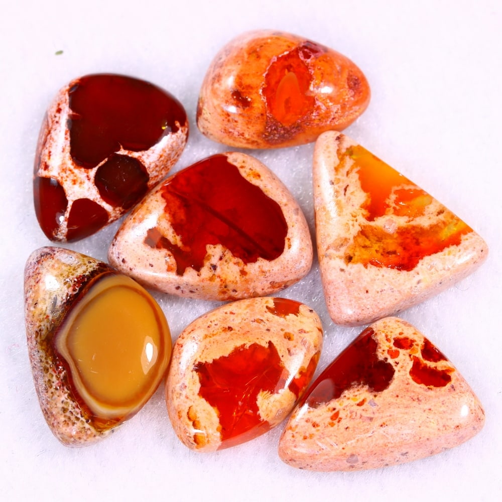 21.38Ct Group of 7 Mexican Fire Opal - Mexican Opal - Cabochon: Ksmith Jewels Global Welcome to our auction house, today auction brought to you by Ksmith Jewels Global based in Penang, Malaysia specialize in all kinds of opal and color gemstone both in manufacturi
