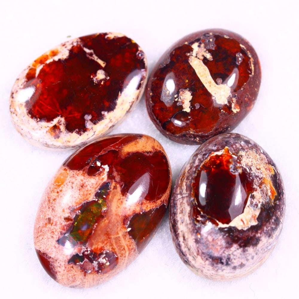 38.11Ct Group of 4 Mexican Fire Opal - Mexican Opal - Cabochon: Ksmith Jewels Global Welcome to our auction house, today auction brought to you by Ksmith Jewels Global based in Penang, Malaysia specialize in all kinds of opal and color gemstone both in manufacturi