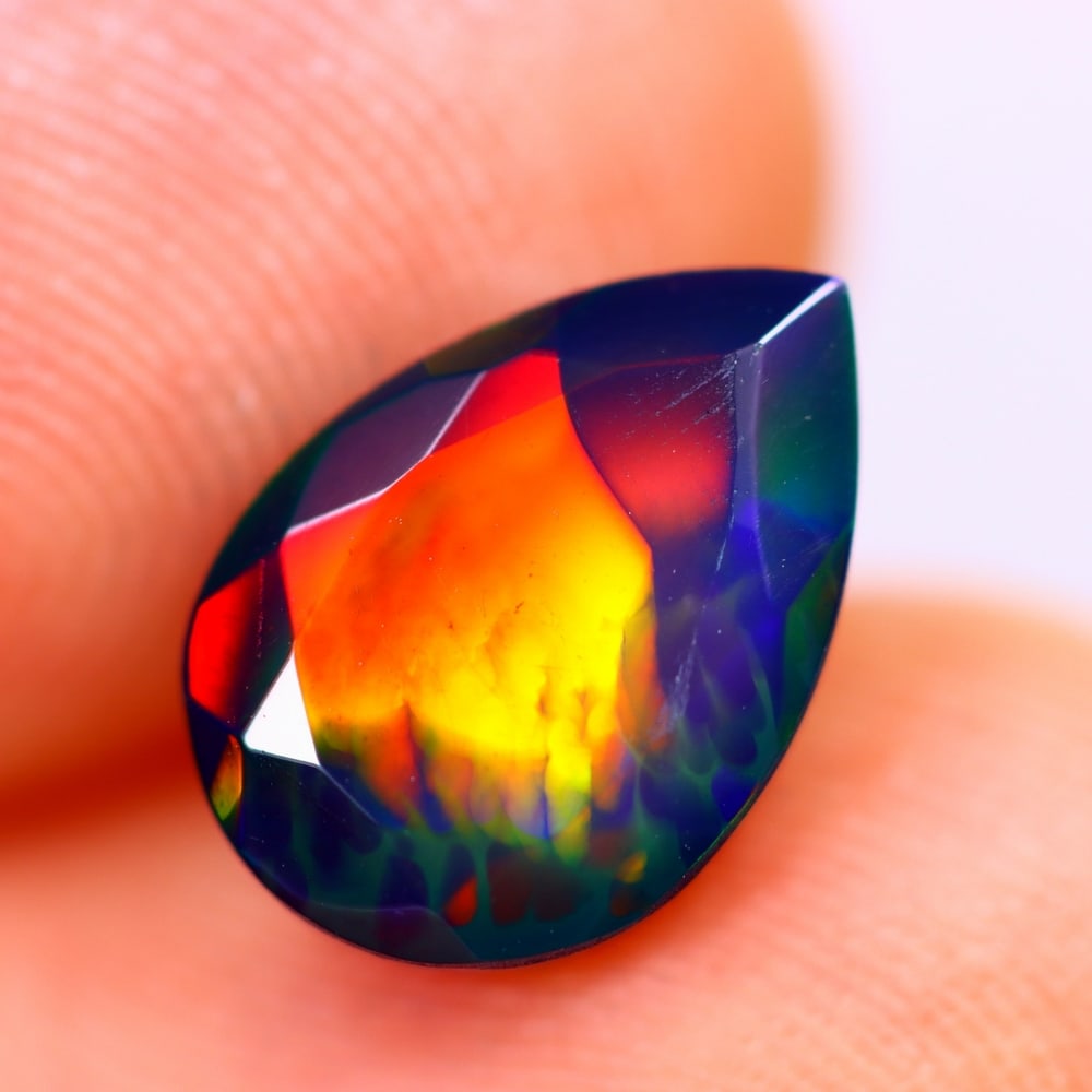 1.67Ct Welo Black Opal Polished - Ethiopian Opal - Pear Faceted: Ksmith Jewels Global Welcome to our auction house, today auction brought to you by Ksmith Jewels Global based in Penang, Malaysia specialize in all kinds of opal and color gemstone both in manufacturi
