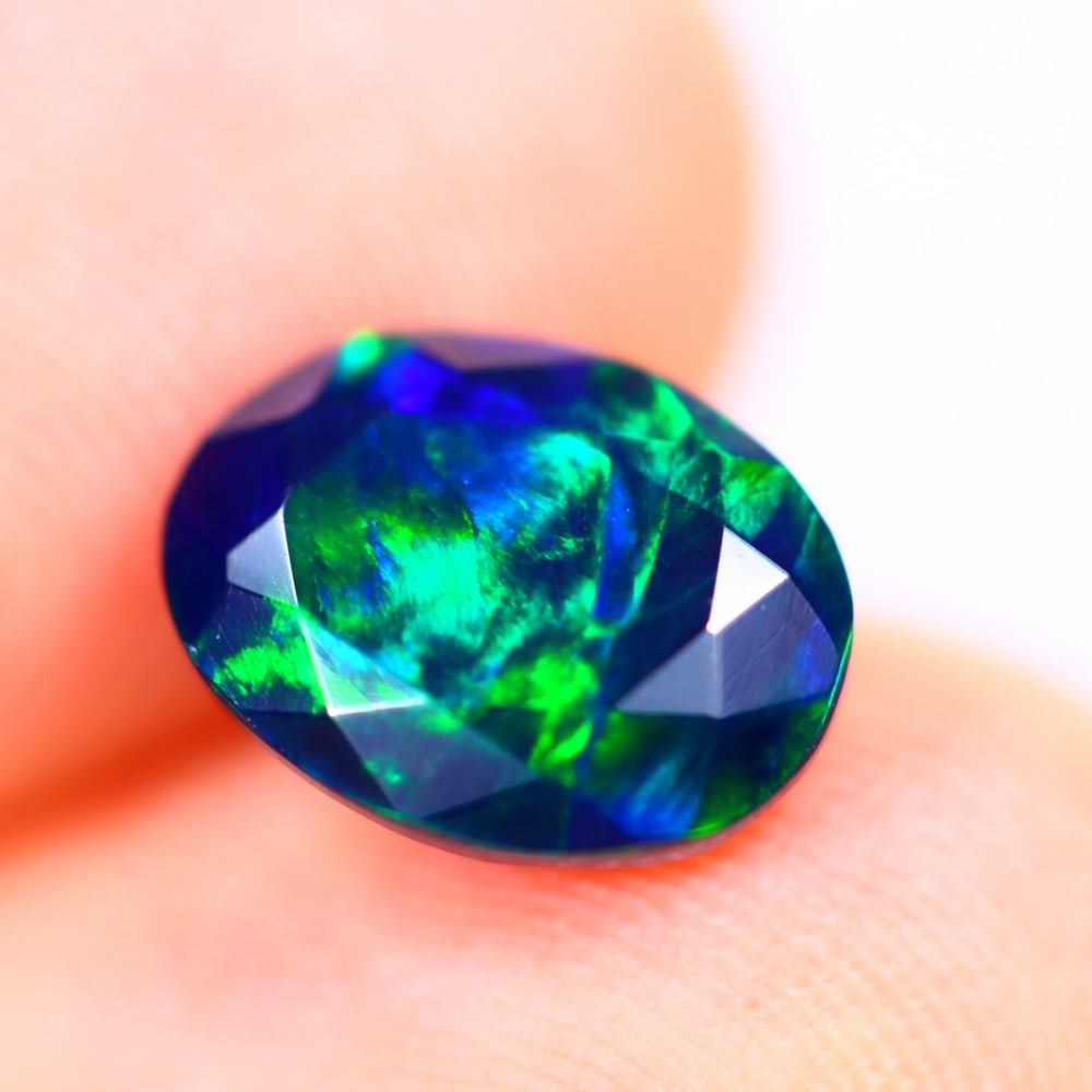 1.01Ct Welo Black Opal Polished - Ethiopian Opal - Oval Faceted: Ksmith Jewels Global Welcome to our auction house, today auction brought to you by Ksmith Jewels Global based in Penang, Malaysia specialize in all kinds of opal and color gemstone both in manufacturi