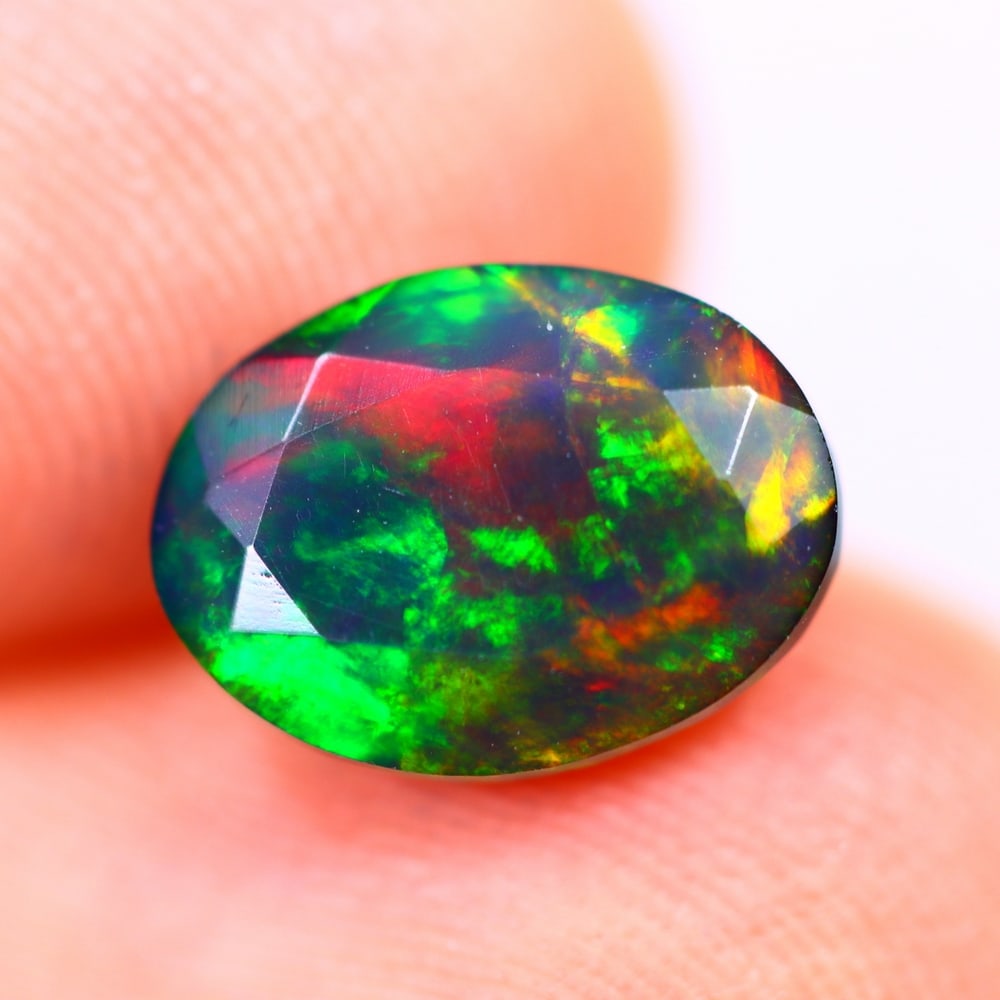 1.38Ct Welo Black Opal Polished - Ethiopian Opal - Oval Faceted: Ksmith Jewels Global Welcome to our auction house, today auction brought to you by Ksmith Jewels Global based in Penang, Malaysia specialize in all kinds of opal and color gemstone both in manufacturi