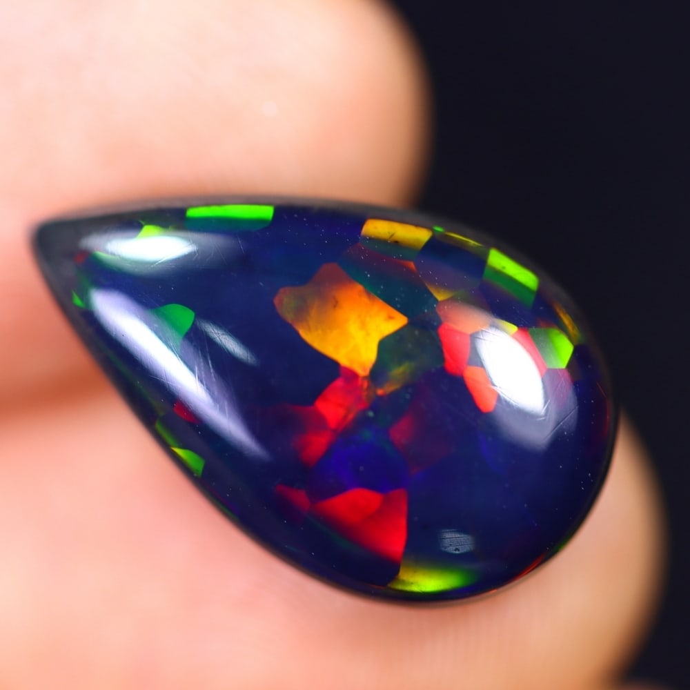 4.82Ct Welo Black Opal Polished - Ethiopian Opal - Pear Cabochon: Ksmith Jewels Global Welcome to our auction house, today auction brought to you by Ksmith Jewels Global based in Penang, Malaysia specialize in all kinds of opal and color gemstone both in manufacturi