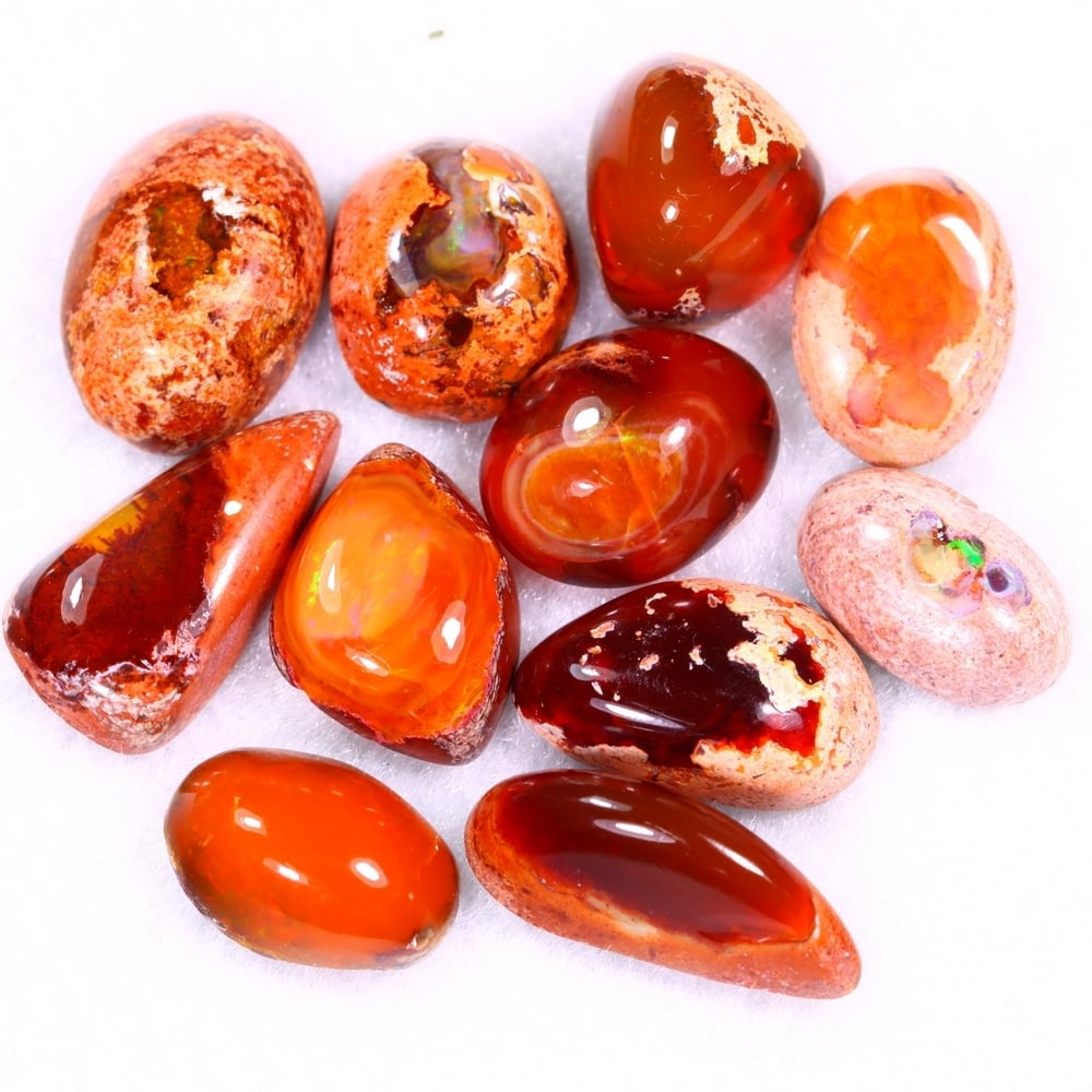 28.14Ct Group of 11 Mexican Fire Opal - Mexican Opal - Cabochon: Ksmith Jewels Global Welcome to our auction house, today auction brought to you by Ksmith Jewels Global based in Penang, Malaysia specialize in all kinds of opal and color gemstone both in manufacturi