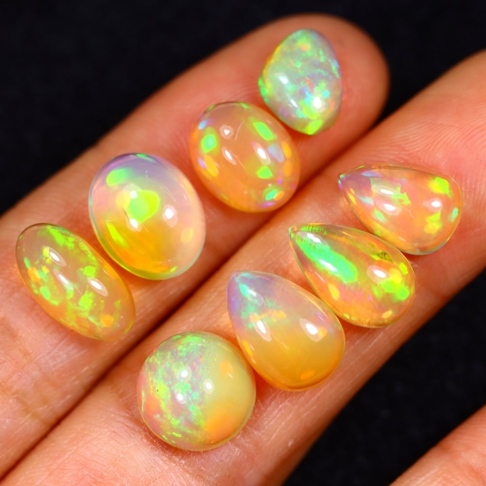 14.26Ct Group of 8 Welo Opal Polished - Ethiopian Opal: Ksmith Jewels Global Welcome to our auction house, today auction brought to you by Ksmith Jewels Global based in Penang, Malaysia specialize in all kinds of opal and color gemstone both in manufacturi