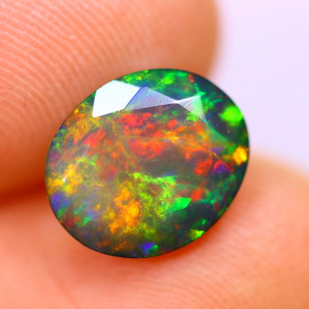 1.80Ct Welo Black Opal Polished - Ethiopian Opal - Oval Faceted: Ksmith Jewels Global Welcome to our auction house, today auction brought to you by Ksmith Jewels Global based in Penang, Malaysia specialize in all kinds of opal and color gemstone both in manufacturi