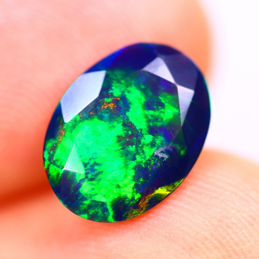 1.37Ct Welo Black Opal Polished - Ethiopian Opal - Oval Faceted: Ksmith Jewels Global Welcome to our auction house, today auction brought to you by Ksmith Jewels Global based in Penang, Malaysia specialize in all kinds of opal and color gemstone both in manufacturi