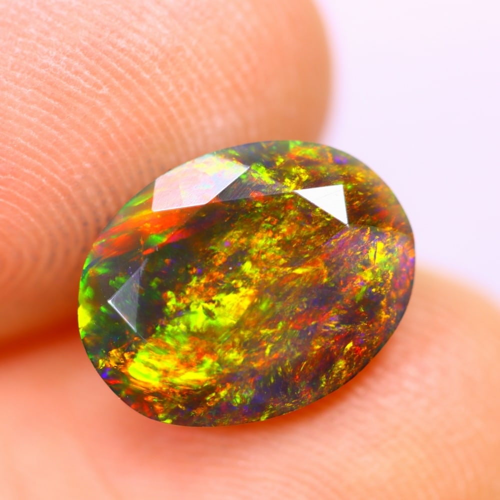 1.80Ct Welo Black Opal Polished - Ethiopian Opal - Oval Faceted: Ksmith Jewels Global Welcome to our auction house, today auction brought to you by Ksmith Jewels Global based in Penang, Malaysia specialize in all kinds of opal and color gemstone both in manufacturi