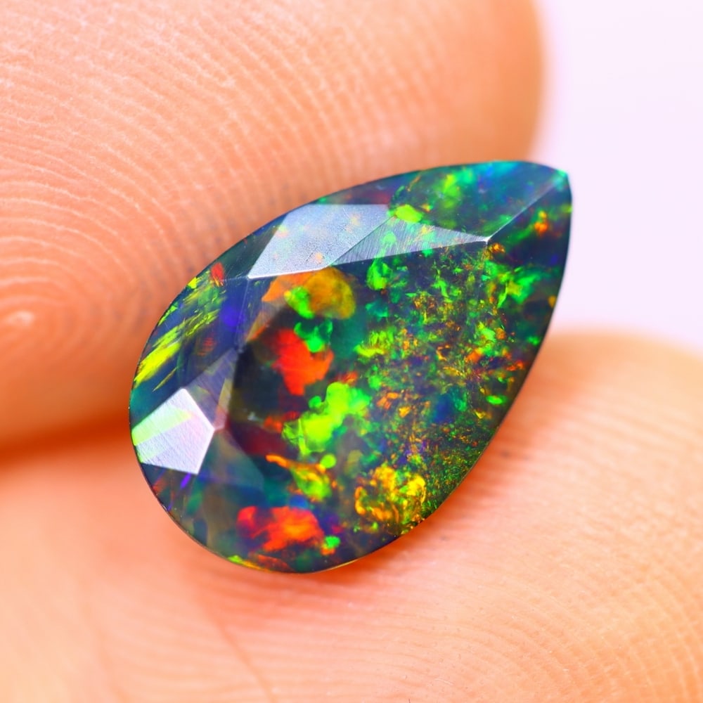 1.54Ct Welo Black Opal Polished - Ethiopian Opal - Pear Faceted: Ksmith Jewels Global Welcome to our auction house, today auction brought to you by Ksmith Jewels Global based in Penang, Malaysia specialize in all kinds of opal and color gemstone both in manufacturi