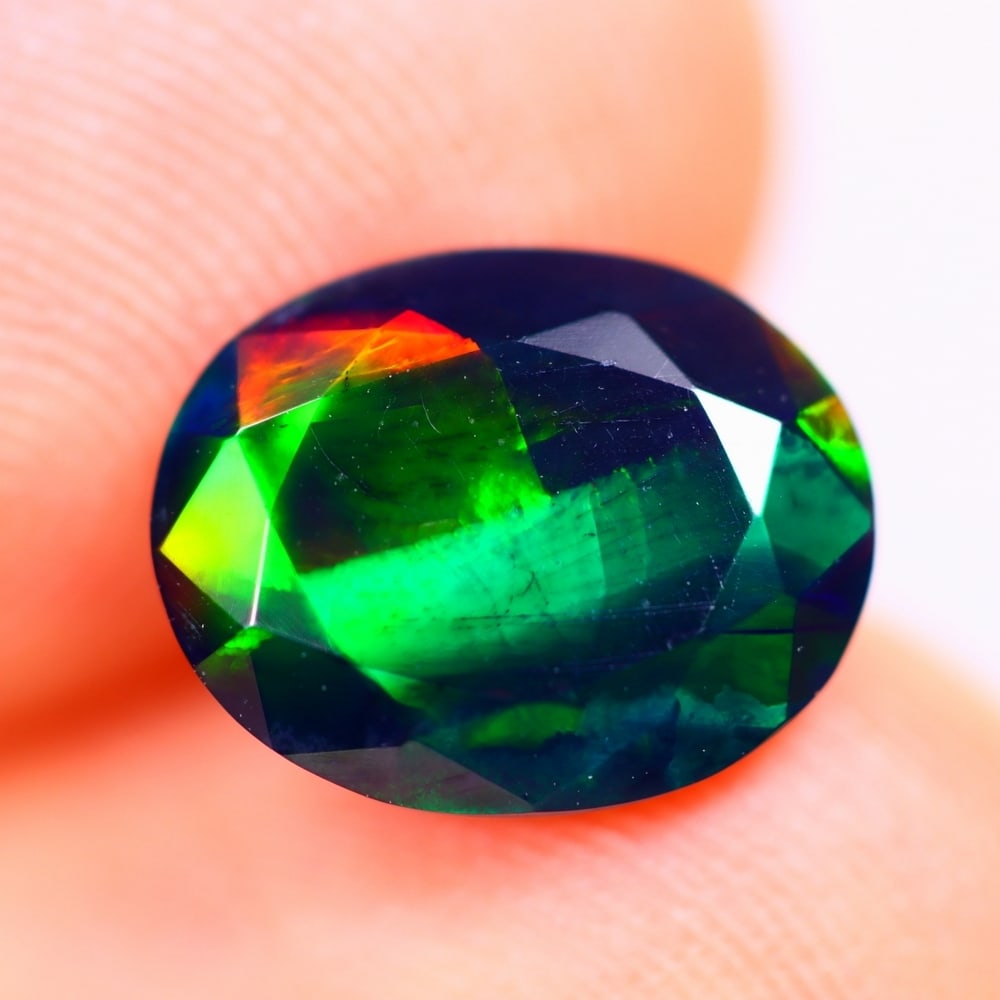 1.44Ct Welo Black Opal Polished - Ethiopian Opal - Oval Faceted: Ksmith Jewels Global Welcome to our auction house, today auction brought to you by Ksmith Jewels Global based in Penang, Malaysia specialize in all kinds of opal and color gemstone both in manufacturi
