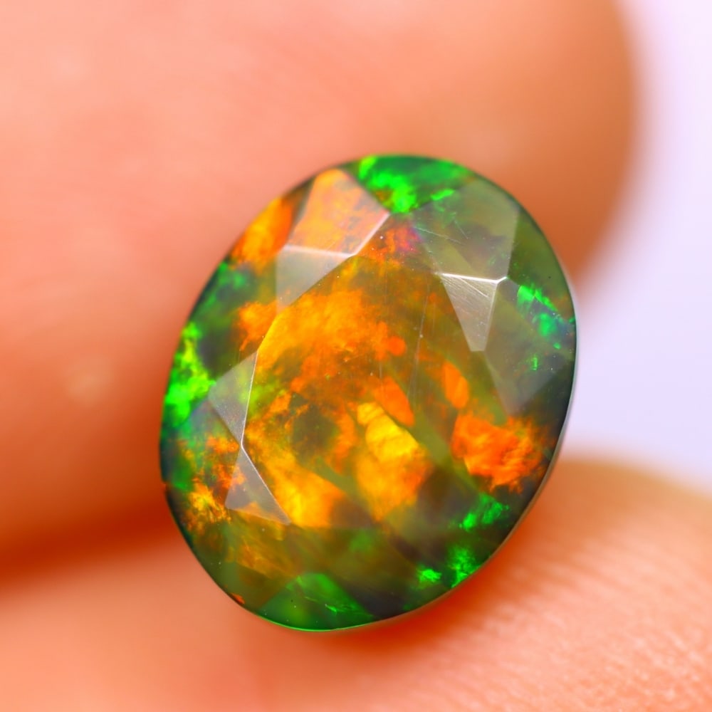 1.96Ct Welo Black Opal Polished - Ethiopian Opal - Oval Faceted: Ksmith Jewels Global Welcome to our auction house, today auction brought to you by Ksmith Jewels Global based in Penang, Malaysia specialize in all kinds of opal and color gemstone both in manufacturi