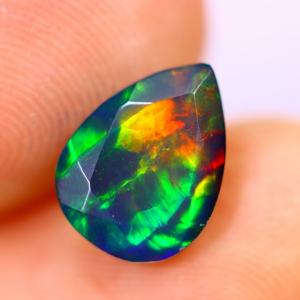 1.44Ct Welo Black Opal Polished - Ethiopian Opal - Pear Faceted: Ksmith Jewels Global Welcome to our auction house, today auction brought to you by Ksmith Jewels Global based in Penang, Malaysia specialize in all kinds of opal and color gemstone both in manufacturi