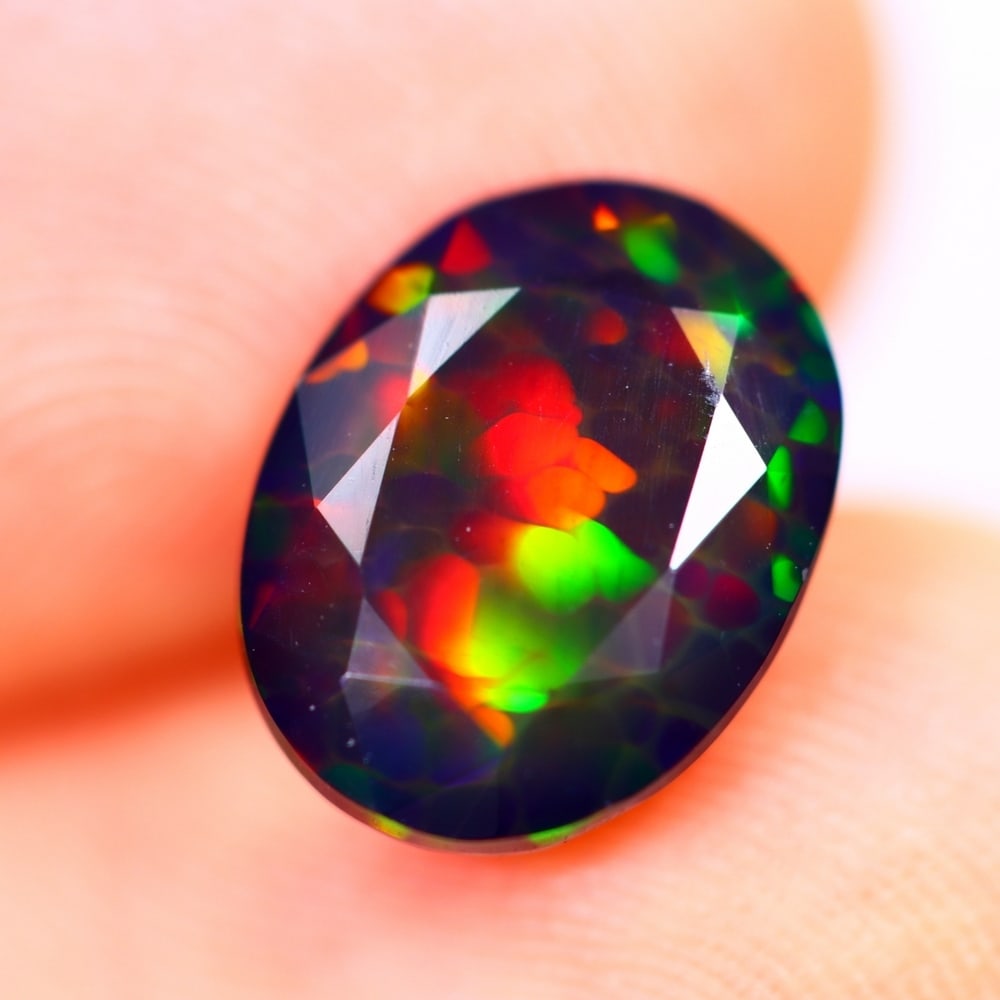1.94Ct Welo Black Opal Polished - Ethiopian Opal - Oval Faceted: Ksmith Jewels Global Welcome to our auction house, today auction brought to you by Ksmith Jewels Global based in Penang, Malaysia specialize in all kinds of opal and color gemstone both in manufacturi