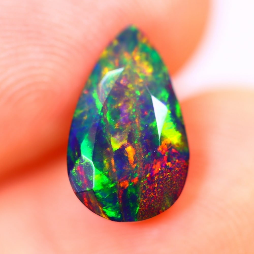 1.43Ct Welo Black Opal Polished - Ethiopian Opal - Pear Faceted: Ksmith Jewels Global Welcome to our auction house, today auction brought to you by Ksmith Jewels Global based in Penang, Malaysia specialize in all kinds of opal and color gemstone both in manufacturi